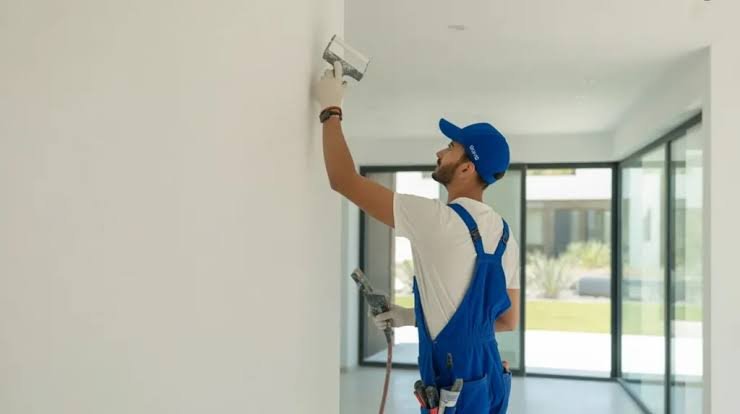 Paint being applied to a wall with a roller